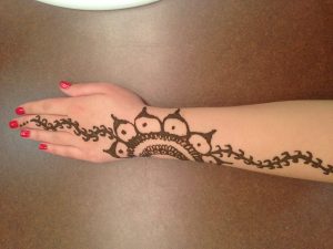 Olivia Barfield shows off Indian design on her hand.