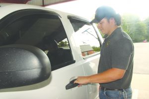 Stewart drives trustee-inmates to and from local markets during his shift.
