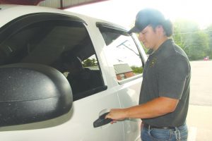 Stewart drives trustee-inmates to and from local markets during his shift. 