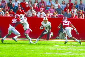  Ajalen Holley sprints  down the field. 