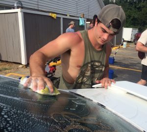 From Left to Right: Kappa Alpha member Colby Spillers washes another student’s car in support of Alpha Omicron Pi member Carissa Sawyer.